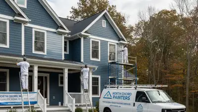 Professional house painters enhancing home exterior in Worcester, MA