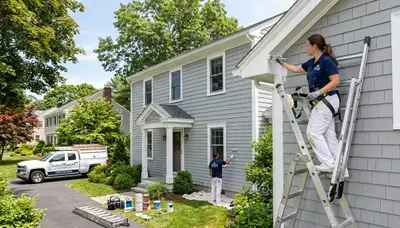 Professional house painters in Worcester MA working on residential exterior painting project